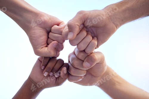Preview: Shot of a group of people fist bumping one another in a circle