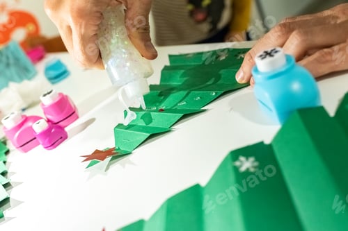 Preview: Christmas crafts with colored paper and glue.
