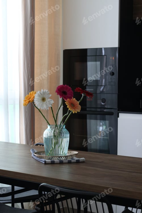 Preview: Fresh Flowers in a Vase in Kitchen Setting