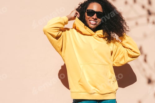 Preview: Young beautiful woman posing outdoors