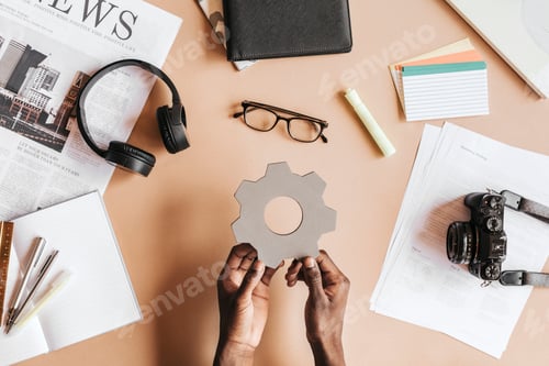 Preview: Man holding a cog wheel