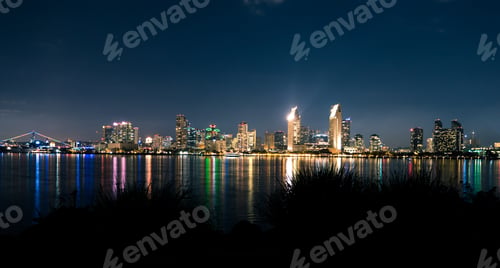 Preview: San Diego city lights skyline at night with colorful reflection on water