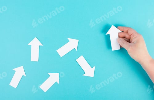 Preview: White arrows on a blue background, one is standing out, do different, be a winner, individuality