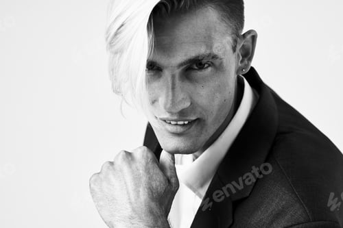 Preview: Cheerful man with fashionable hairstyle in suit elegant style portrait light background