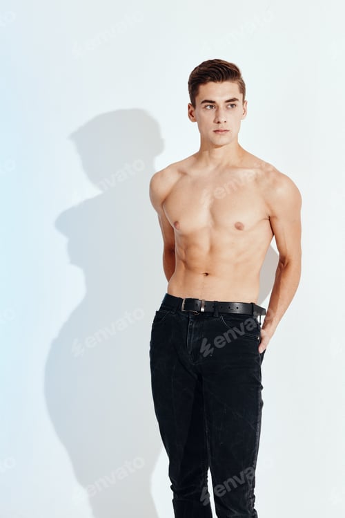 Preview: Sexy men with a naked torso and in black trousers holding their hands behind their backs