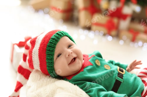 Preview: Cute baby in Christmas costume at home