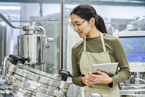 Preview: Engineer examining equipment at workshop