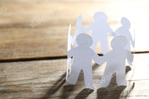 Preview: Paper people chain making circle on wooden background, space for text. Unity concept