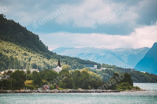 Preview: Vartdal, Norway. Landscape With Vartdal Town And Old Wooden Church. Church. Skyline Cityscape In
