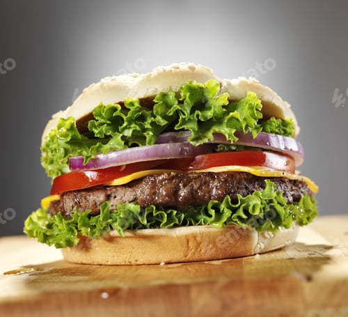 Preview: cheeseburger with lettuce tomato and onion.