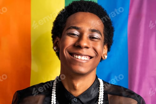 Preview: Fashionable fluid gender man posing in studio