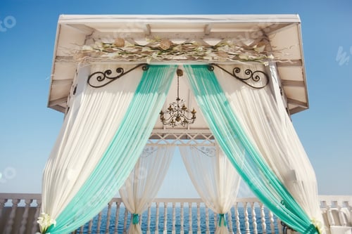 Preview: Wedding arch in Tiffany color on the beach.