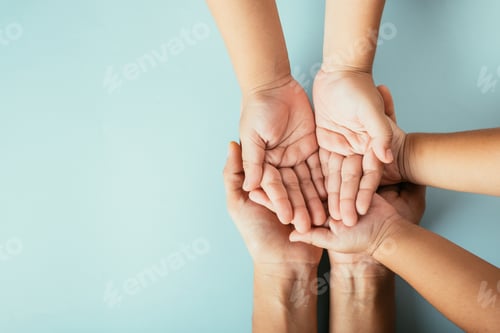 Preview: Close-up top view of family hands stack isolated background. Parents and kid hold empty space