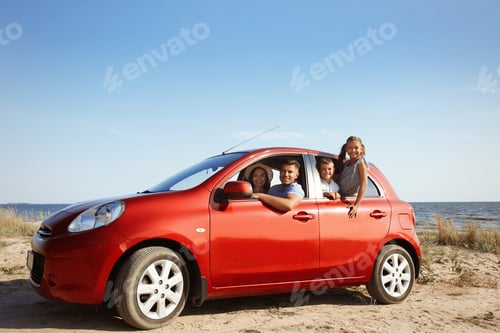 Preview: Happy family in car near sea. Summer trip