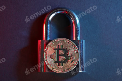 Preview: Bitcoin and padlock on blue background in red light, top view