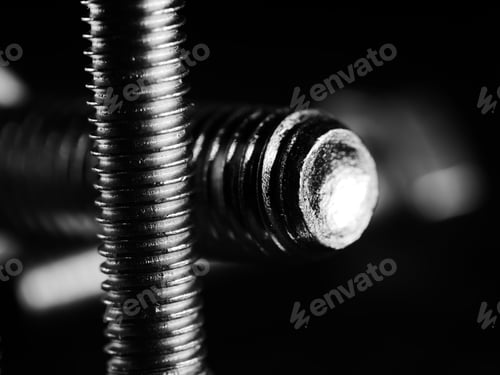 Preview: Studio grayscale of screws on black background