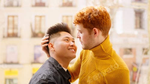 Preview: Gay couple about to kiss on the balcony