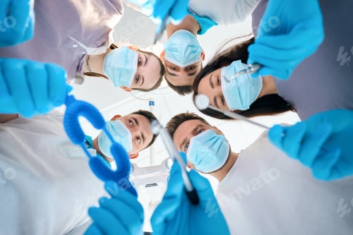 Preview: Five doctors, men and women, with dental instruments in their hands