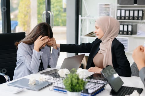 Preview: Furious Asian businesspeople arguing strongly after making a mistake at work in office