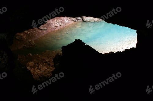 Preview: Cave entrance view form inside. Underground turquoise lake
