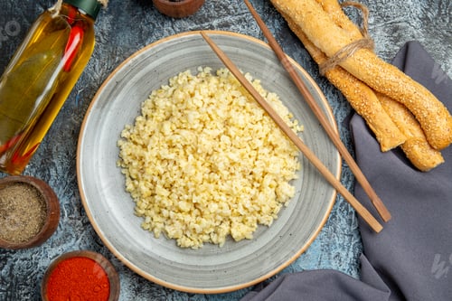 Preview: top view cooked pearl barley with seasonings on light background meal dish dinner rice
