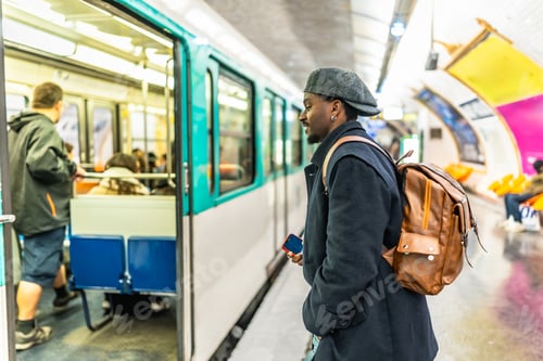 Preview: Young man commuting in urban subway station platform