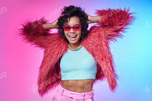 Preview: Excited African woman in fluffy jacket holding hands in hair and smiling against colorful background