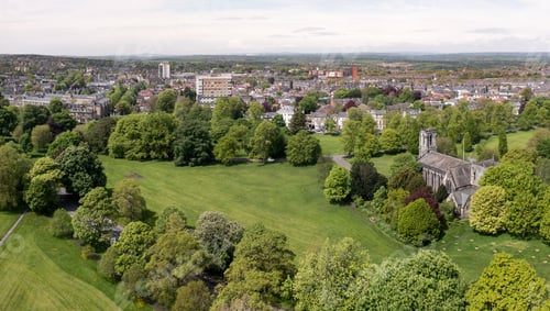 Preview: Aerial townscape view of Harrogate with local church in The Stray public park