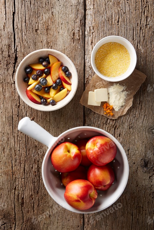 Preview: Fresh blueberries and nectarines with dry polenta, butter, orange zest and organic flour
