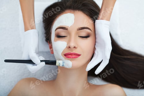 Preview: Facial Skin Care. Beautiful Woman Getting Cosmetic Mask In Salon