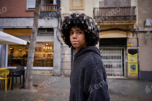 Preview: Young student walking in urban city street