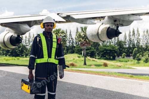 Preview: Aircraft workers checking airplane.