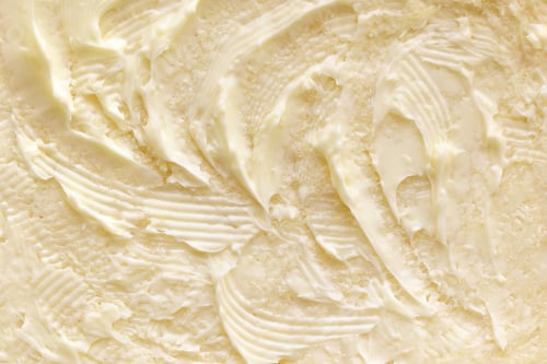 Preview: Margarine on bread texture background.