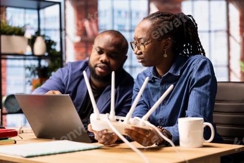 Preview: Young man and woman struggling with internet weak connection at home