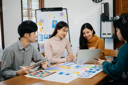Preview: Group of Asian business meeting in planning design in creative business discussing work