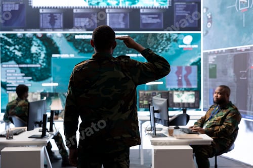 Preview: Team of army professionals in a mission control center use advanced technology