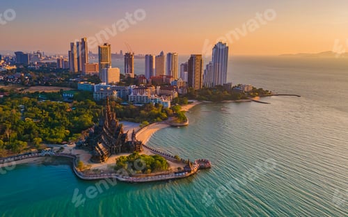 Preview: Sanctuary of Truth, Pattaya, Thailand, wooden temple by the ocean at sunset on the beach of Pattaya