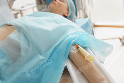 Preview: Syringe for administering anesthesia in the patient's arm. General anesthesia during surgery.