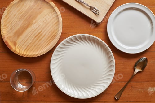 Preview: Flat lay of three plates and some cutlery