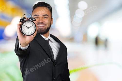 Preview: Young black man with alarm clock