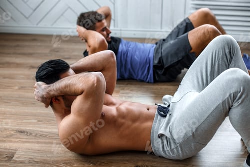 Preview: Two guys doing stomach workouts.