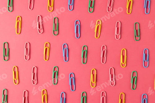 Preview: Composition of colorful clips on pin surface