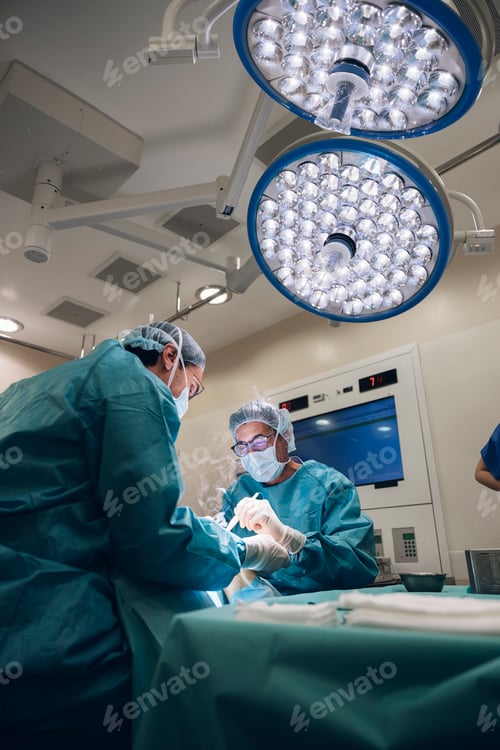 Preview: Surgeons Performing Operation in Brightly Lit Operating Room