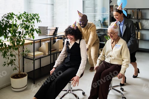 Preview: Diverse Middle Aged and Senior Colleagues Celebrating Retirement Indoors