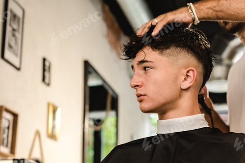 Preview: Teenager getting a modern haircut in a vintage barber shop