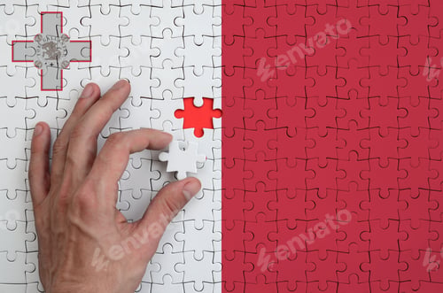 Preview: Malta flag is depicted on a puzzle, which the man's hand completes to fold.