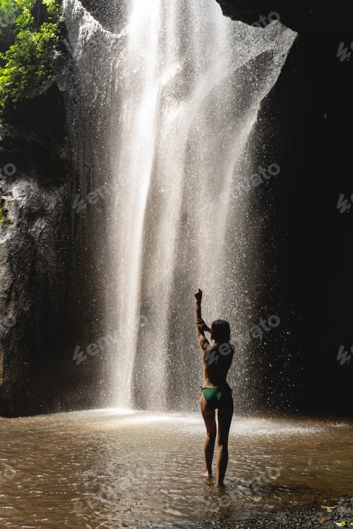 Preview: Attractive female person enjoying her washing in cave