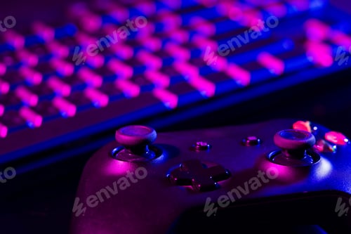Preview: Computer keyboard and joystick on black background close up