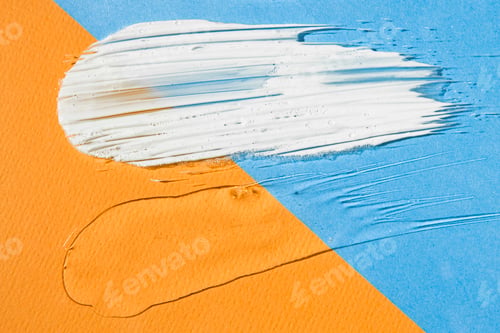 Preview: Samples of cosmetic products for sun protection on a multi-colored orange and blue background