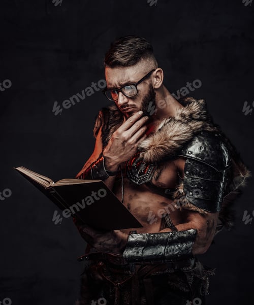 Preview: Clever viking reading a book in dark background